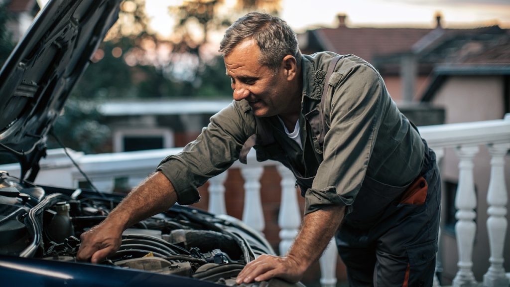 Mechanic repairing car